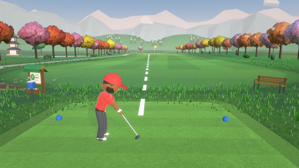 A golfer on the tee at Sakura Gardens, cherry trees lining the fairway